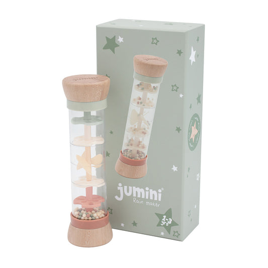 Jumini rain maker with pink base and lid in front of its packaging box on a white background
