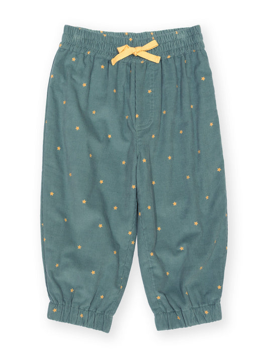 A pair of toddler's elastic-waist pants in a muted teal green, decorated with a small yellow star pattern and a matching yellow bow on the waist.