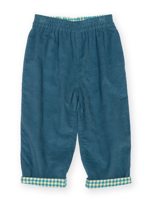 A pair of toddler's blue corduroy pants with a green and white gingham check lining at the cuffs and waistband, shown flat on a white background.