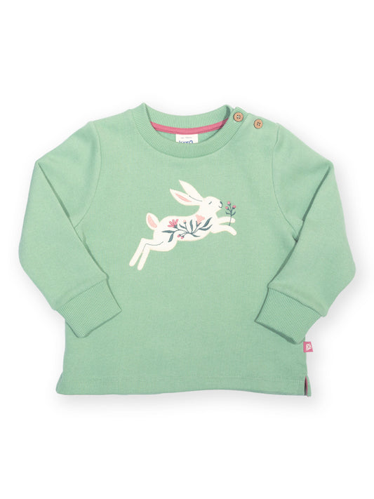 A mint green long-sleeve baby sweatshirt featuring a white embroidered bunny holding a pink flower on the chest, with snap buttons on the shoulders and a small pink tag on the hem.