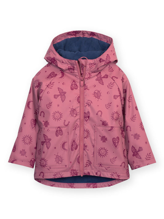 A pink hooded children's jacket with a dark purple allover whimsical print of butterflies, suns, and moons, featuring a blue interior lining.