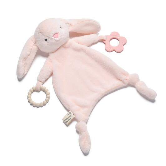 Pink plush bunny toy with teething rings on a white background