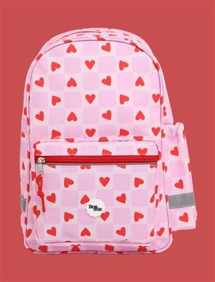 Pink backpack with red heart pattern on a red background